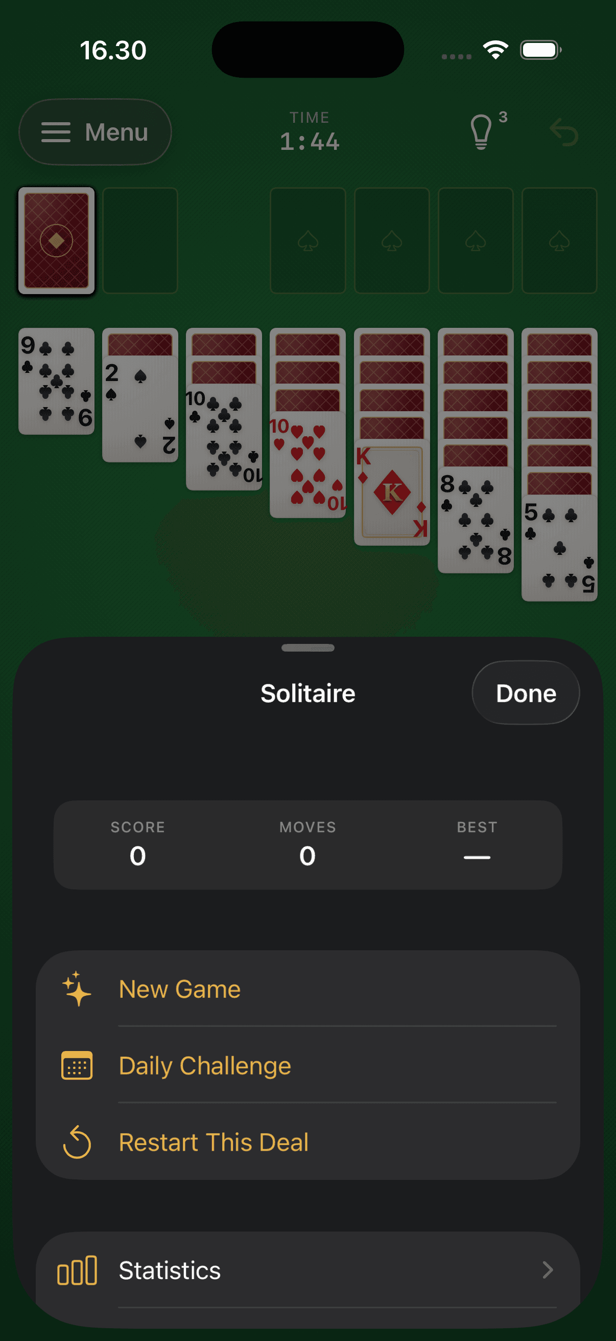 The game menu with score, moves and best time, plus New Game, Daily Challenge, Restart This Deal and Statistics